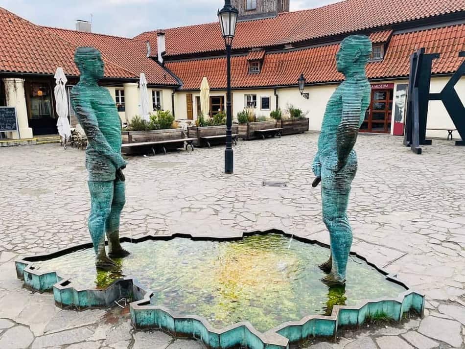 Peeing Characters Sculpture